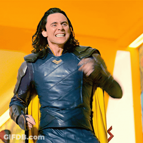 Man In Superhero Costume With Yellow Cape Smiling GIF