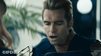 Man In Superhero Suit Talking To Woman GIF