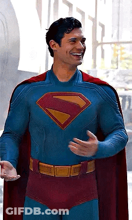 Man In Superman Costume And Cape Smiling GIF