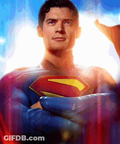 Man In Superman Costume Arms Crossed Looking At Camera GIF