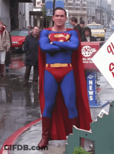 Man In Superman Costume At News Box GIF