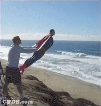 Man In Superman Costume Being Lifted GIF