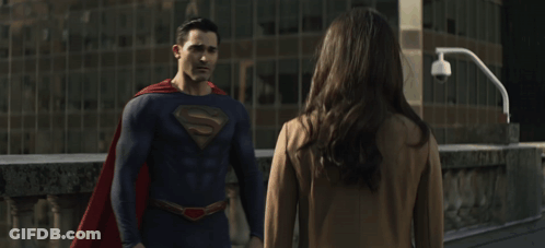 Man In Superman Costume Hugging Woman GIF