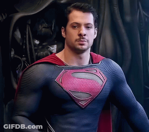 Man In Superman Costume Looking At Camera GIF