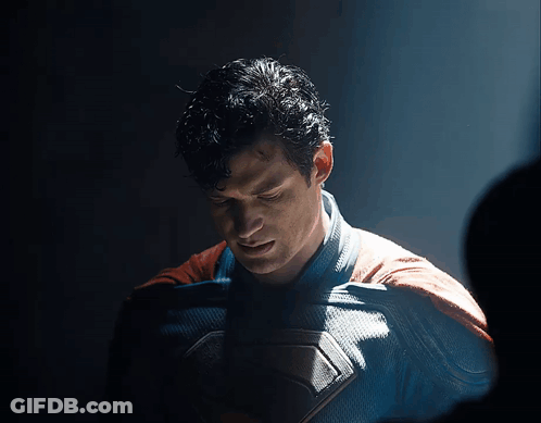 Man In Superman Costume Looking Down GIF