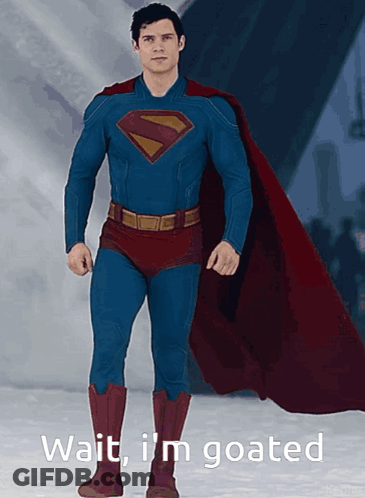 Man In Superman Costume Lying In Chair GIF