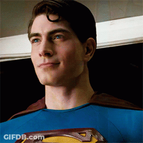 Man In Superman Costume Smiling GIF