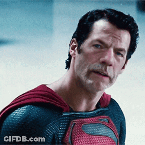 Man In Superman Costume Standing By News Box GIF
