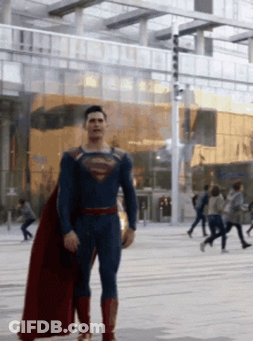 Man In Superman Costume Walking Street GIF