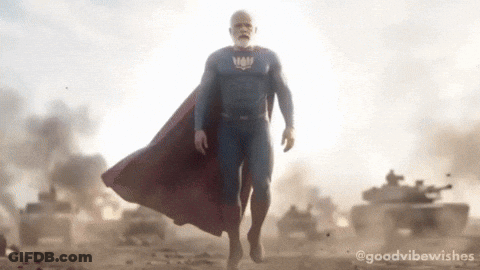 Man In Superman Costume Walking GIF