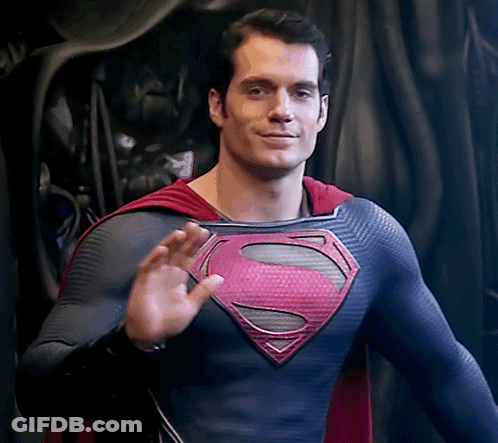 Man In Superman Costume Waving GIF