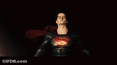 Man In Superman Costume With Glowing Eyes GIF