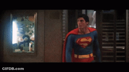 Man In Superman Costume With Letter S On Chest GIF