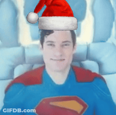 Man In Superman Costume With Santa Hat GIF
