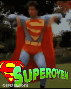 Man In Superman Costume With Superoyen Behind GIF