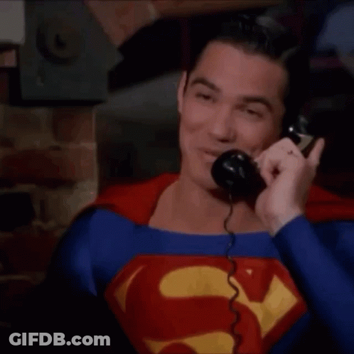 Man In Superman Suit Talking On Phone GIF