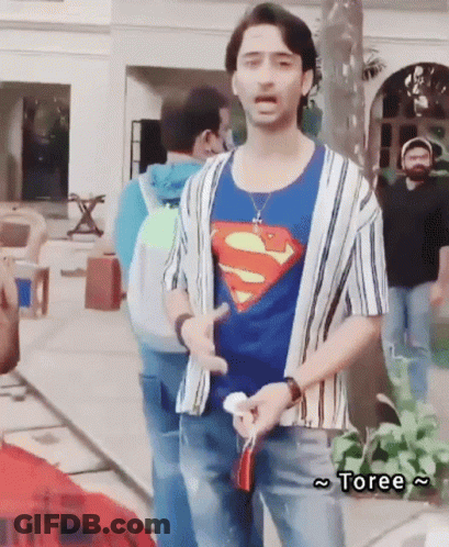 Man In Superman T-Shirt Standing Before Group GIF