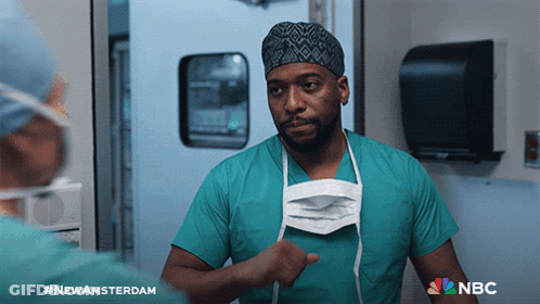Man In Surgical Mask With NBC Logo GIF