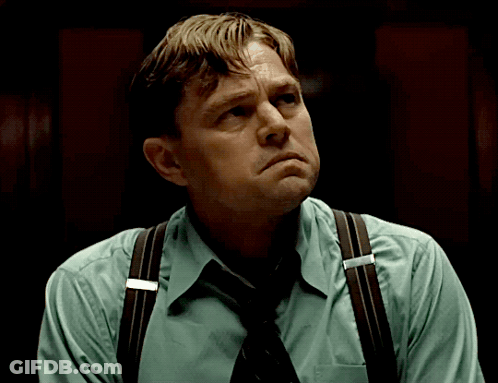 Man In Suspenders And Tie Looking Down GIF