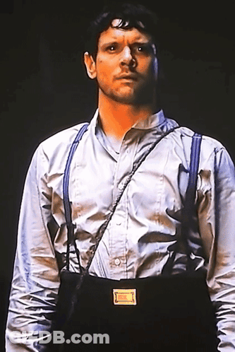 Man In Suspenders And White Shirt With Yellow Badge GIF