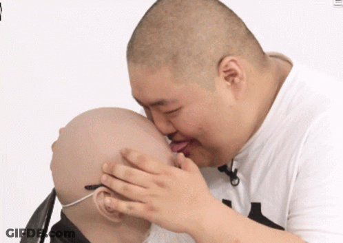 Man In Suzuki Hat Talking To Group GIF