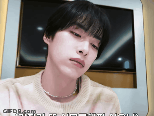 Man In Sweater And Pearl Necklace GIF