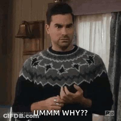 Man In Sweater Asking Why On Phone GIF