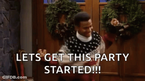 Man In Sweater At Christmas Wreath Door GIF