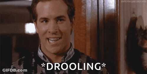 Man In Sweater Drooling GIF