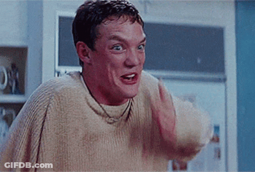 Man In Sweater Making Funny Face GIF