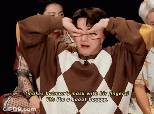 Man In Sweater Saying Makes Batman Mask With Fingers GIF