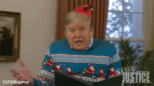 Man In Sweater Saying Merry GIF