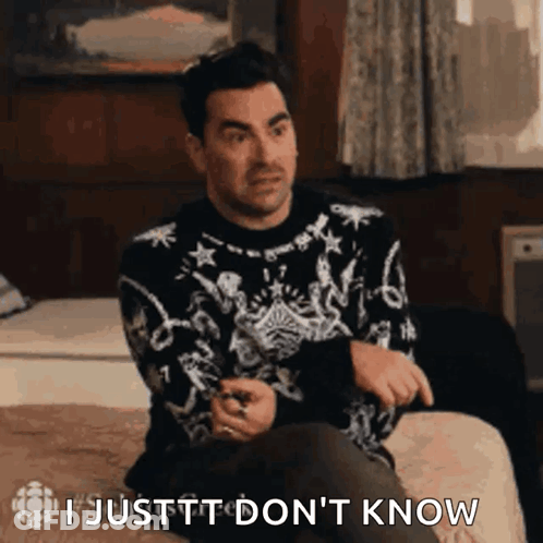Man In Sweater Sitting On Bed Saying I Justtt Don't Know GIF