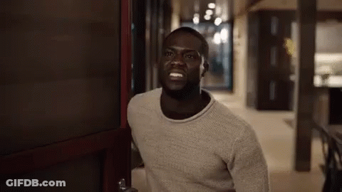 Man In Sweater Standing In Doorway GIF