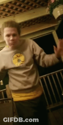 Man In Sweatshirt With Yellow Circle On Porch GIF