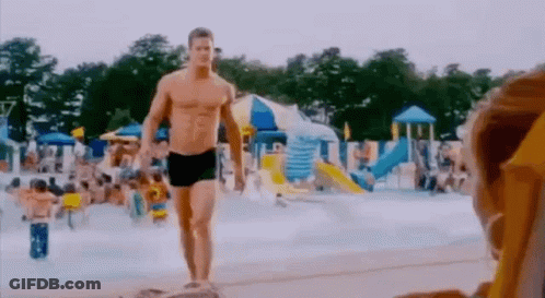 Man In Swim Trunks Walking Water Park GIF