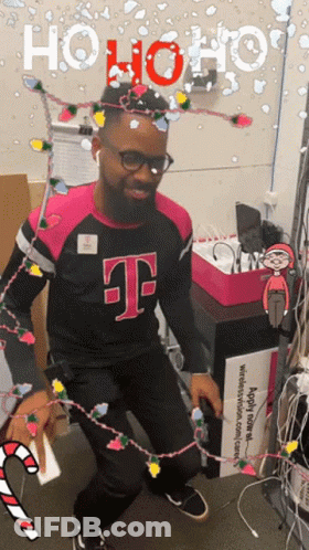 Man In T-Mobile Shirt Dancing With Christmas Lights GIF