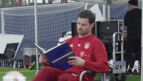 Man In T-Mobile Shirt Reading Book GIF