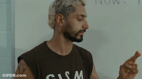 Man In T-Shirt Crosses Fingers GIF