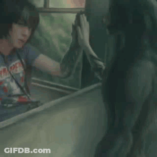 Man In T-Shirt Looking In Mirror GIF