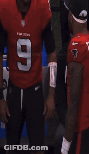 Man In Tagovailoa Jersey Escorted By Woman With Gatorade GIF