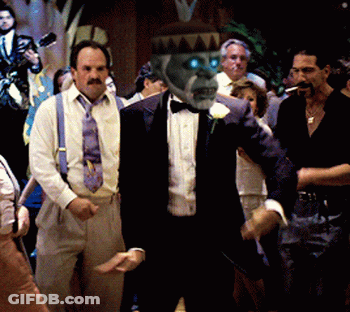Man In Tan Coat And Black Sweater Making Face GIF