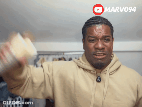 Man In Tan Hoodie Holding Coffee GIF