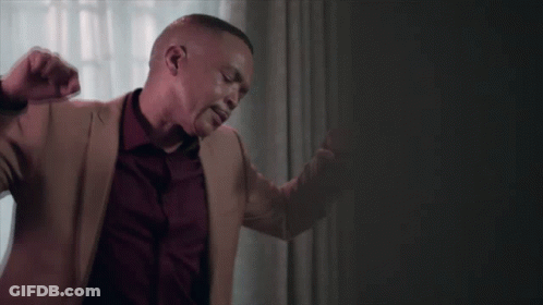 Man In Tan Jacket And Red Shirt Dancing GIF