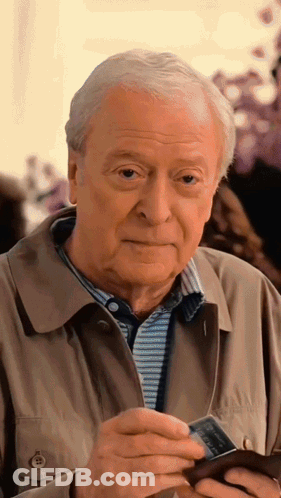 Man In Tan Jacket Holding Visa Card GIF