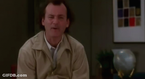 Man In Tan Jacket Making Funny Face GIF