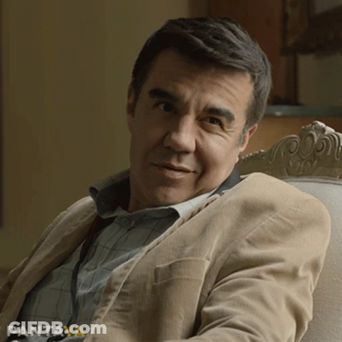 Man In Tan Jacket Sitting In Chair With Pantaya GIF