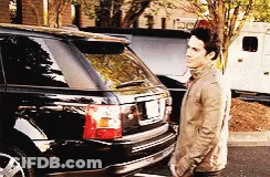Man In Tan Jacket With Black Range Rover GIF