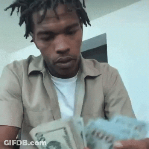 Man In Tan Shirt Holding Money GIF