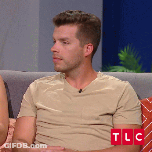 Man In Tan Shirt On Couch With TLC GIF